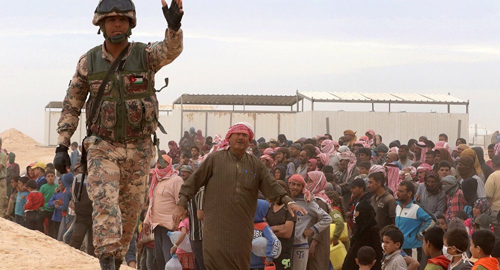 Syrian refugees near Jordan border get first aid since weeks