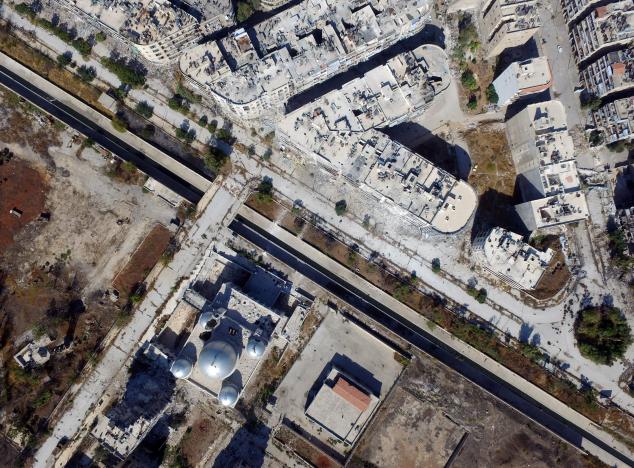 A general view taken with a drone shows a road separating Aleppo's government-controlled areas from the rebel-held ones in Syria October 20, 2016. REUTERS/Abdalrhman Ismail